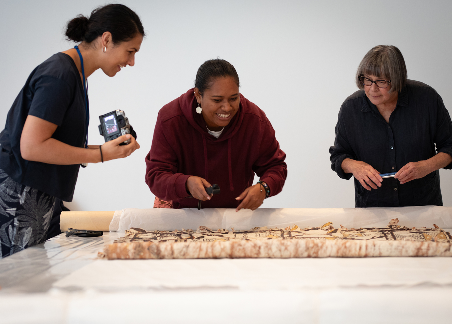 Pasifika artists working on a Ngatu - tapa cloth - at the Govett-Brewster Art Gallery as part of the Koloa artist residency.