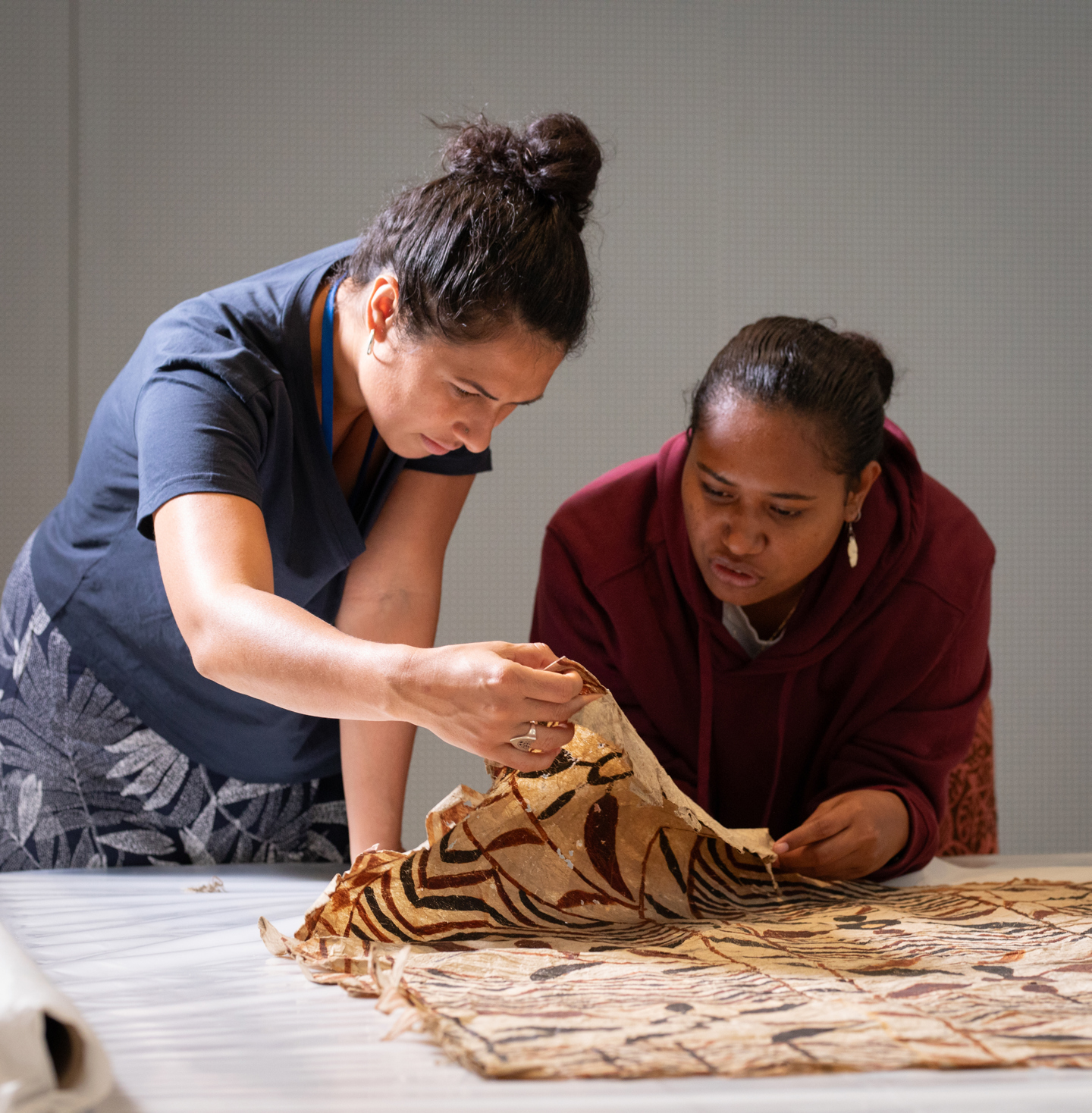 Two Pasifika artists from the Koloa artist residency, working with ngatu - tapa cloth